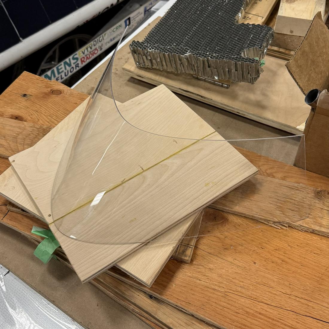 Finished polycarbonate windshield formed by the in-house thermoforming process, fitted to the solar car canopy.